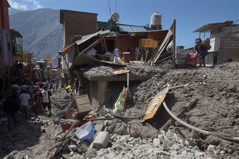 cleaning mud Peru|Mudslides smash 5 villages in Peru; death toll lowered to 12.